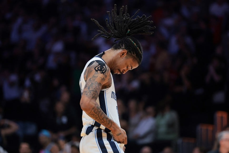 Apr 3, 2025; Miami, Florida, USA; Memphis Grizzlies guard Ja Morant (12) reacts after scoring the game-winning shot against the Miami Heat during the fourth quarter at Kaseya Center. Mandatory Credit: Sam Navarro-Imagn Images