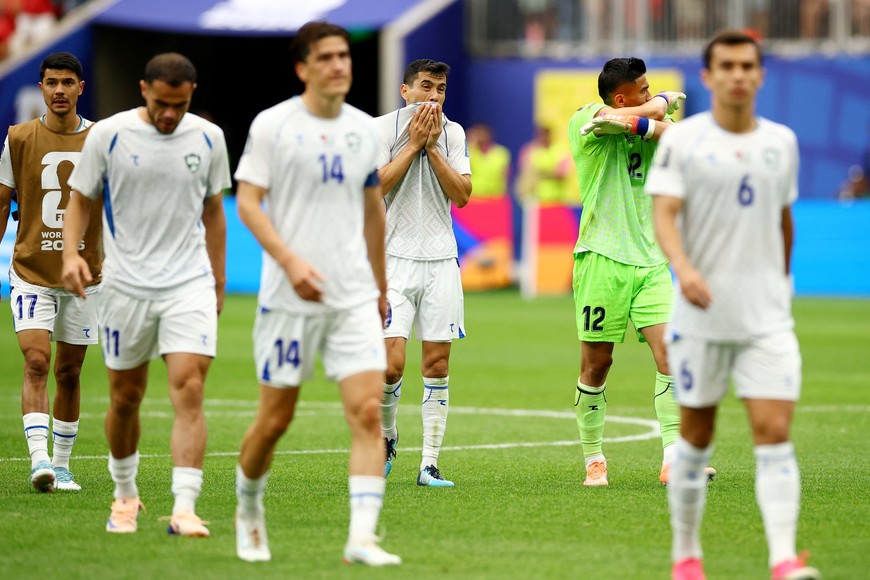 Soccer Football - FIFA World Cup 2026 - Group K - Portugal v Uzbekistan - Houston Stadium, Houston, Texas, U.S. - June 23, 2026
Uzbekistan's Azizjon Ganiev and teammates look dejected after the match REUTERS/Phil Noble
