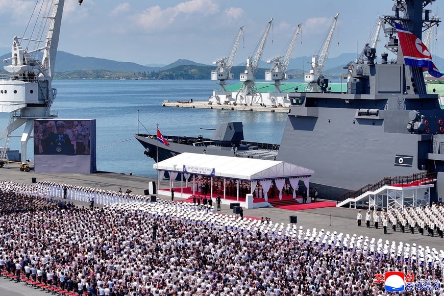 A screen shows North Korean leader Kim Jong Un speaking during the commissioning ceremony of the new multipurpose destroyer Choe Hyon at Nampho port, North Korea, June 23, 2026, in this picture released by North Korea's official Korean Central News Agency. KCNA via REUTERS ATTENTION EDITORS - THIS IMAGE WAS PROVIDED BY A THIRD PARTY. REUTERS IS UNABLE TO INDEPENDENTLY VERIFY THIS IMAGE. NO THIRD PARTY SALES. SOUTH KOREA OUT. NO COMMERCIAL OR EDITORIAL SALES IN SOUTH KOREA.