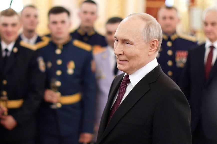 Russia's President Vladimir Putin attends a meeting with graduates of higher education institutions of the Defence Ministry, Emergencies Ministry, Federal Security Service, Federal Guard Service, National Guard, Interior Ministry, Investigative Committee and Federal Penitentiary Service in Moscow, Russia, June 23, 2026. Sputnik/Gavriil Grigorov/Pool via REUTERS ATTENTION EDITORS - THIS IMAGE WAS PROVIDED BY A THIRD PARTY.