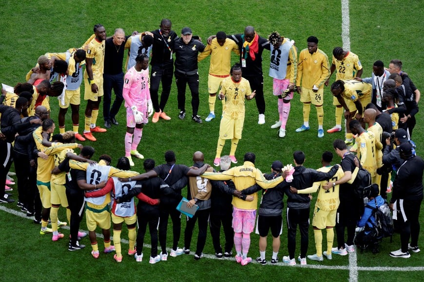 Soccer Football - FIFA World Cup 2026 - Group L - England v Ghana - Boston Stadium, Foxborough, Massachusetts, U.S. - June 23, 2026
Ghana players and coaching staff form a circle around Abdul Fatawu and Benjamin Asare after the match REUTERS/Pilar Olivares