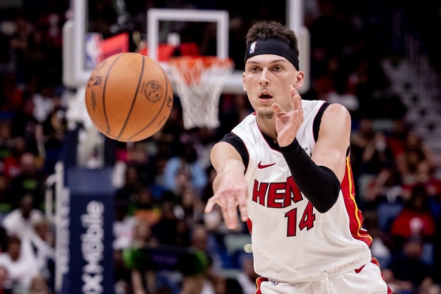 Feb 23, 2024; New Orleans, Louisiana, USA; Miami Heat guard Tyler Herro (14) passes the ball against the New Orleans Pelicans during the first half at Smoothie King Center. Mandatory Credit: Stephen Lew-USA TODAY Sports