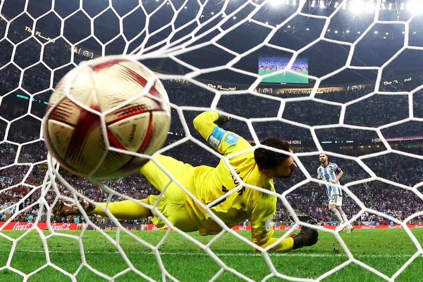 FILE PHOTO: Soccer Football - FIFA World Cup Qatar 2022 - Final - Argentina v France - Lusail Stadium, Lusail, Qatar - December 18, 2022
Argentina's Lionel Messi scores a penalty during the penalty shootout past France's Hugo Lloris REUTERS/Kai Pfaffenbach/File Photo