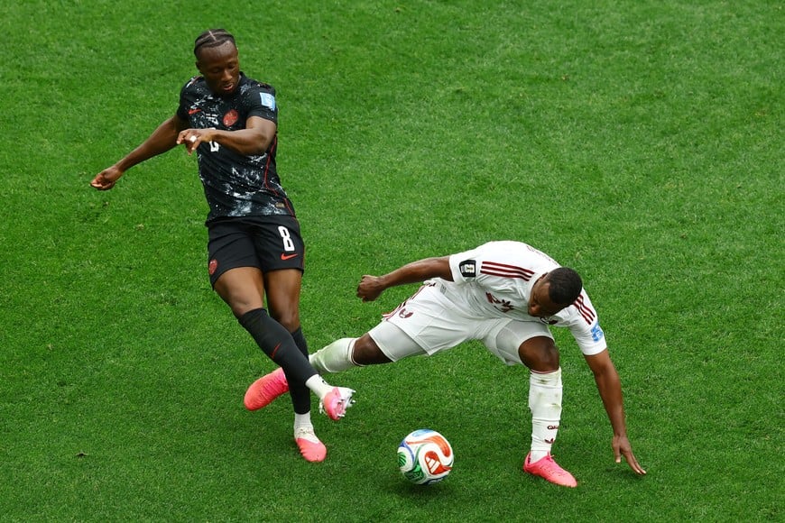 Soccer Football - FIFA World Cup 2026 - Group B - Canada v Qatar - BC Place, Vancouver, Canada - June 18, 2026
Qatar's Assim Madibo fouls Canada's Ismael Kone before he s shown a red card REUTERS/Albert Gea