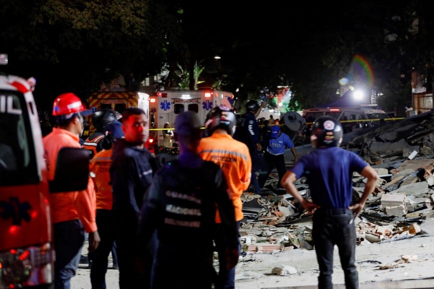 Rescuers work at the site of damaged buildings in the aftermath of an earthquake, in Caracas, Venezuela, June 24, 2026. REUTERS/Fausto Torrealba