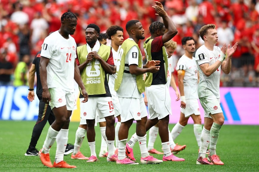 Soccer Football - FIFA World Cup 2026 - Group B - Switzerland v Canada - BC Place, Vancouver, Canada - June 24, 2026
Canada's Alistair Johnston and teammates applaud fans after the match REUTERS/Agustin Marcarian
