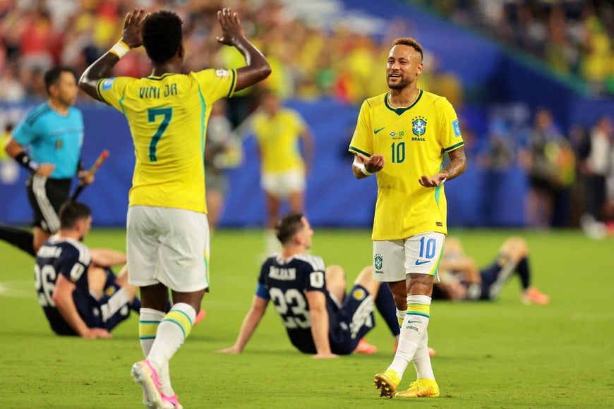 Soccer Football - FIFA World Cup 2026 - Group C - Scotland v Brazil - Miami Stadium, Miami Gardens, Florida, U.S. - June 24, 2026
Brazil's Neymar Jr. celebrates after the match with Vinicius Junior IMAGN IMAGES via Reuters/Sam Navarro     TPX IMAGES OF THE DAY
