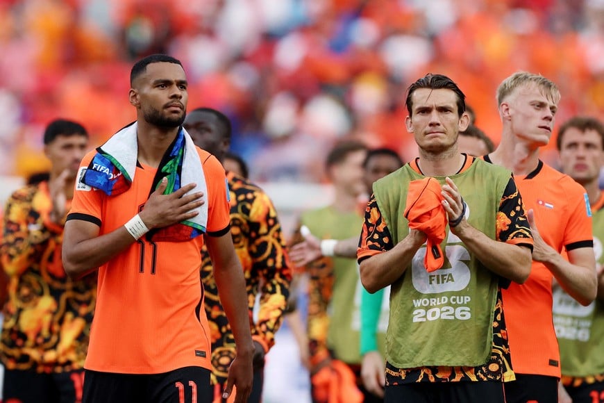 Soccer Football - FIFA World Cup 2026 - Group F - Tunisia v Netherlands - Kansas City Stadium, Kansas City, Missouri, U.S. - June 25, 2026
Netherlands' Cody Gakpo and Marten de Roon celebrate after the match as Netherlands qualify for the knockout stages of the World Cup REUTERS/Siphiwe Sibeko