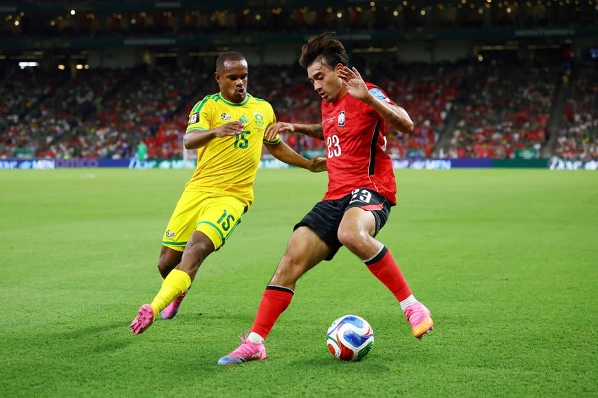 Soccer Football - FIFA World Cup 2026 - Group A - South Africa v South Korea - Estadio Monterrey, Monterrey, Mexico - June 24, 2026
South Korea's Jens Castrop in action with South Africa's Iqraam Rayners REUTERS/Daniel Becerril
