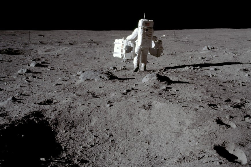 FILE PHOTO: Apollo 11 lunar module pilot Buzz Aldrin carries equipment for the Passive Seismic Experiments (in his left hand) and the Laser Ranging Retroreflector (in his right) to the deployment area at Tranquility Base in the Sea of Tranquility on the moon, July 20, 1969.  Neil Armstrong/NASA/Handout via REUTERS/File Photo   ATTENTION EDITORS - THIS IMAGE HAS BEEN SUPPLIED BY A THIRD PARTY.    PLEASE SEARCH "50TH ANNIVERSARY OF THE MOON LANDING" FOR ALL PICTURES