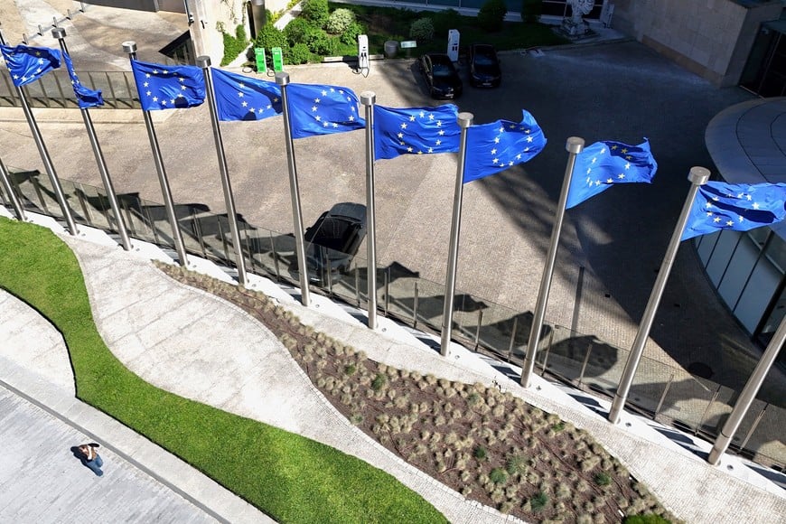 FILE PHOTO: A drone view shows the European Union flags outside the European Commission headquarters, known as the Berlaymont building in Brussels, Belgium, April 29, 2026. REUTERS/Yves Herman/File Photo