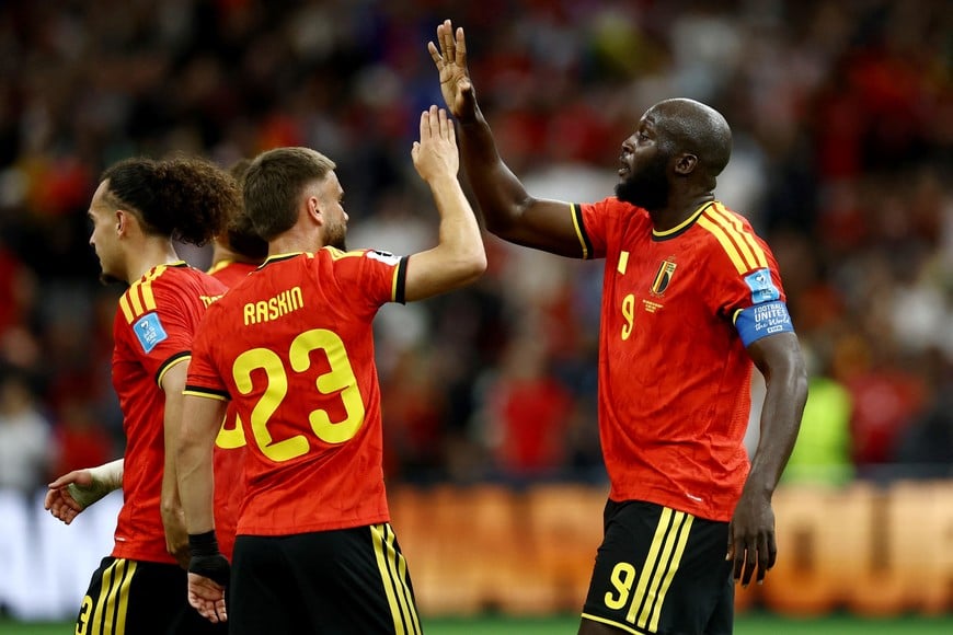 Soccer Football - FIFA World Cup 2026 - Group G - New Zealand v Belgium - BC Place, Vancouver, Canada - June 26, 2026
Belgium's Nicolas Raskin and Romelu Lukaku celebrate after the match as Belgium qualify for the knockout stages of the World Cup REUTERS/Lee Smith