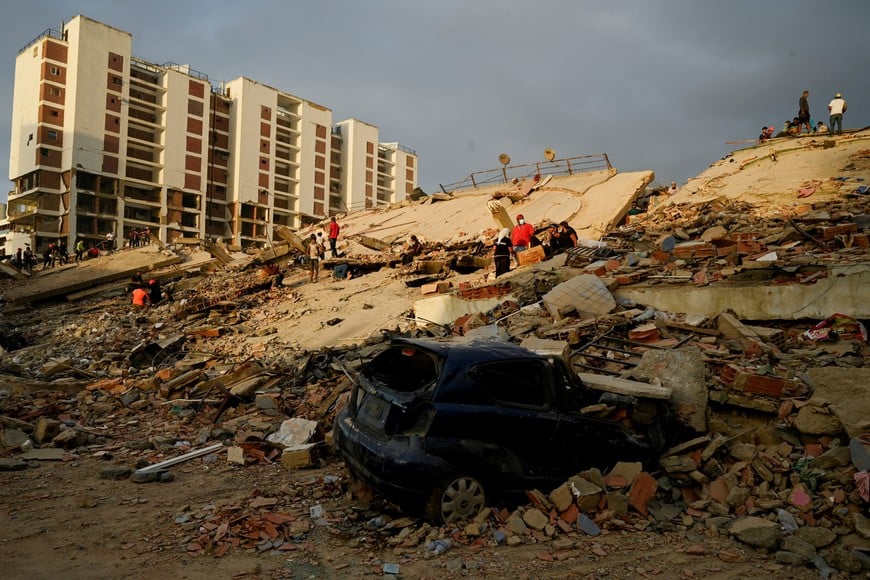A damaged vehicle lies amid rubble as rescue operations continue after earthquakes hit the country in La Guaira, Venezuela, June 27, 2026. REUTERS/Maxwell Briceno