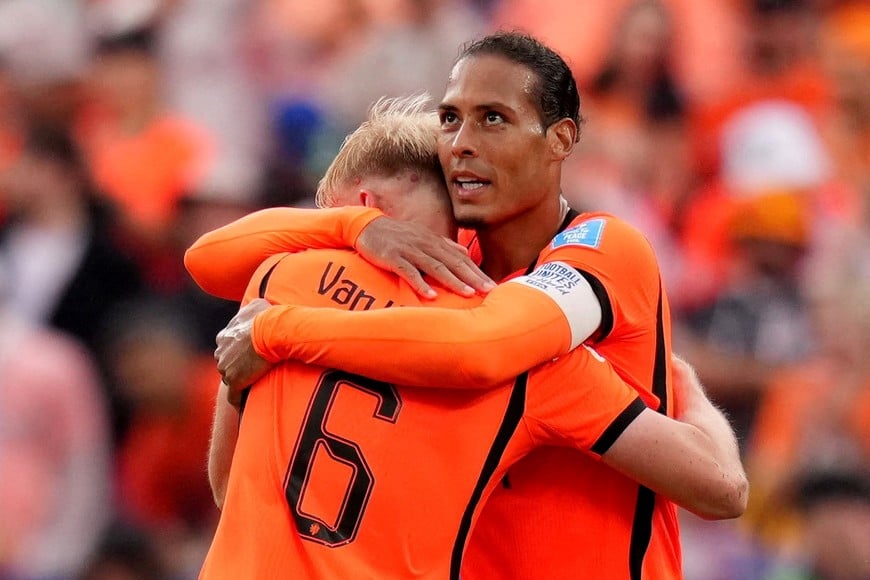 Soccer Football - FIFA World Cup 2026 - Group F - Tunisia v Netherlands - Kansas City Stadium, Kansas City, Missouri, U.S. - June 25, 2026
Netherlands' Virgil van Dijk celebrates after the match with Jan Paul van Hecke IMAGN IMAGES via Reuters/Jay Biggerstaff     TPX IMAGES OF THE DAY