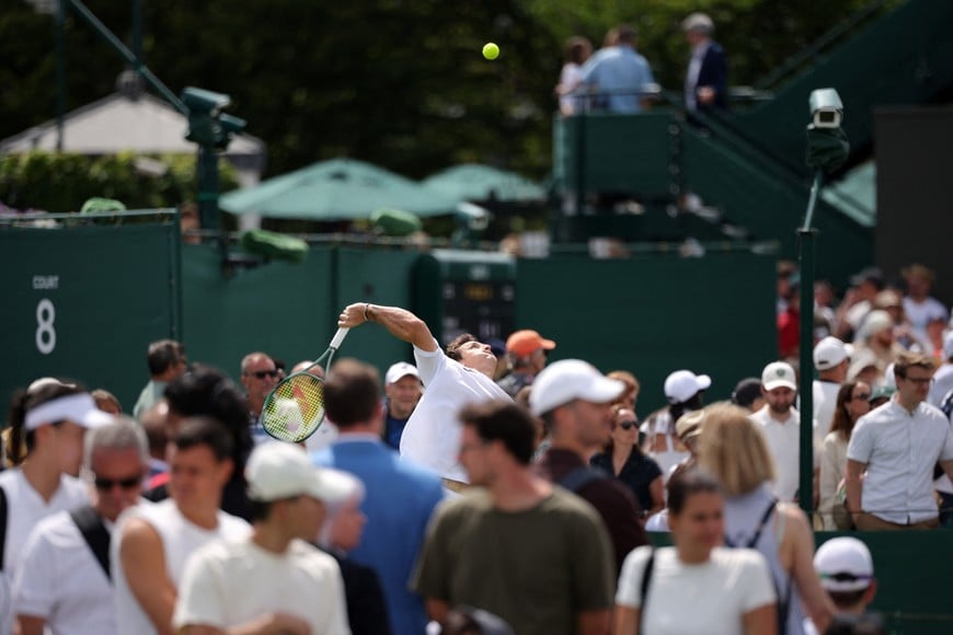 Tennis - Wimbledon - All England Lawn Tennis and Croquet Club, London, Britain - June 29, 2026
General view of Argentina's Camilo Ugo Carabelli in action during his first round match against Spain's Daniel Merida as spectators look on REUTERS/Marko Djurica