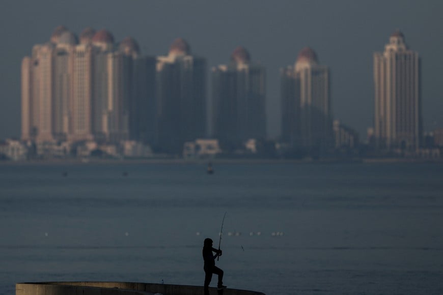 A fisherman catches fish in the Gulf, in Doha, Qatar, February 9, 2026. REUTERS/Mohammed Salem     TPX IMAGES OF THE DAY