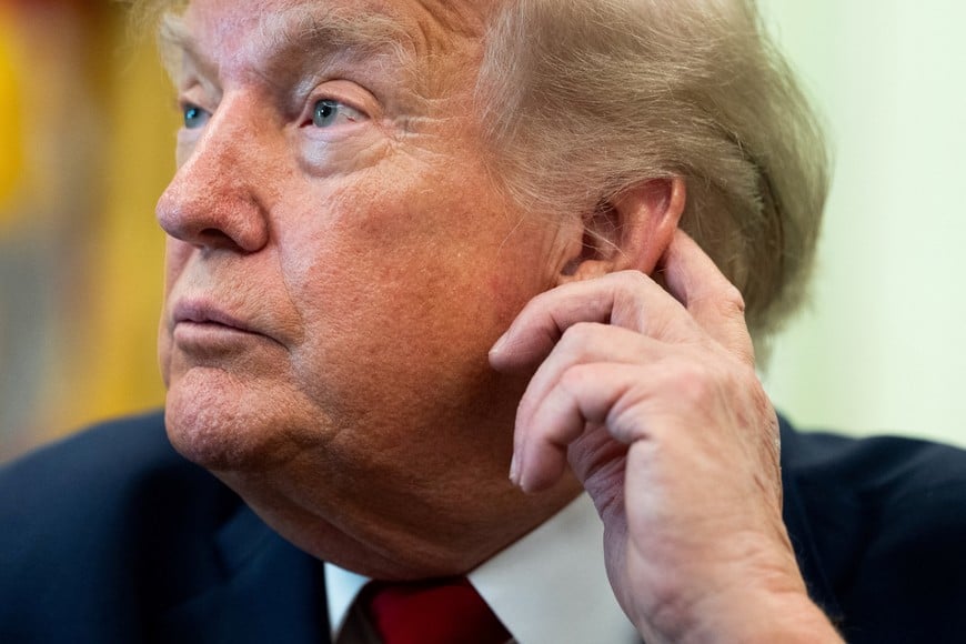 U.S. President Donald Trump looks on after signing an executive order on vehicle repairs in the Oval Office at the White House in Washington, D.C., U.S., June 29, 2026. REUTERS/Aaron Schwartz