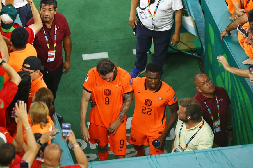 Soccer Football - FIFA World Cup 2026 - Round of 32 - Netherlands v Morocco - Estadio Monterrey, Monterrey, Mexico - June 29, 2026
Netherlands' Wout Weghorst and Denzel Dumfries look dejected after the match as Netherlands are eliminated from the World Cup REUTERS/Raquel Cunha