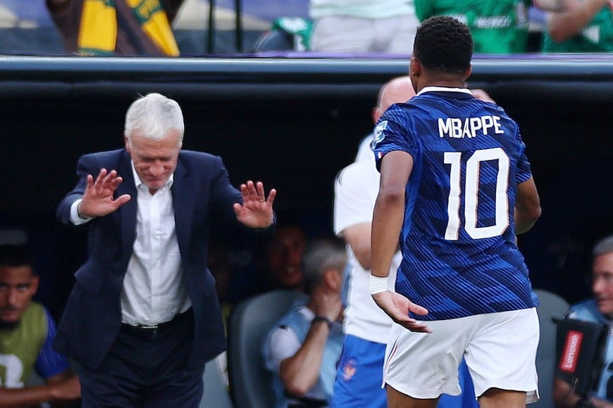 Soccer Football - FIFA World Cup 2026 - Round of 32 - France v Sweden - New York New Jersey Stadium, East Rutherford, New Jersey, U.S. - June 30, 2026
France's Kylian Mbappe with coach Didier Deschamps after being substituted IMAGN IMAGES via Reuters/Vincent Carchietta