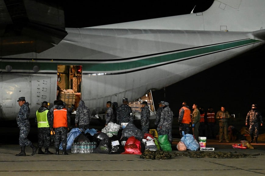 Members of the Bolivian Air Force and rescue teams load humanitarian aid onto a C-130 Hercules aircraft to be sent for search-and-rescue operations following the earthquakes in Venezuela, at the Bolivian Air Force's Diablos Negros Air Base in El Alto, Bolivia, June 29, 2026. REUTERS/Claudia Morales