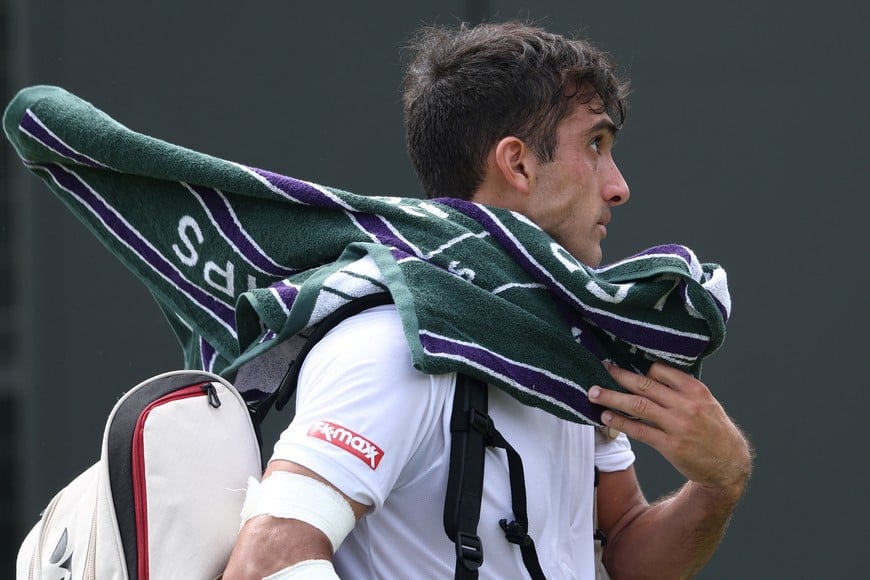 Tennis - Wimbledon - All England Lawn Tennis and Croquet Club, London, Britain - June 30, 2026
Argentina's Roman Andres Burruchaga exits the court after losing his first round match against Australia's Alex de Minaur REUTERS/Toby Melville