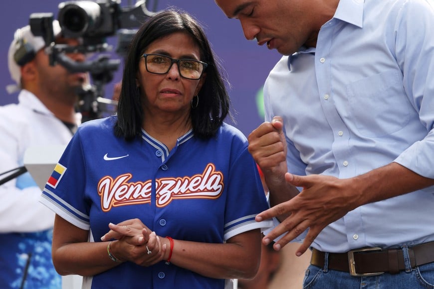 Venezuela’s acting President Delcy Rodriguez speaks with Education Minister Hector Rodriguez during an event announcing an increase in the minimum income, in Caracas, Venezuela April 30, 2026. REUTERS/Leonardo Fernandez Viloria