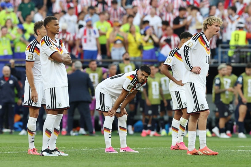 Soccer Football - FIFA World Cup 2026 - Round of 32 - Germany v Paraguay - Boston Stadium, Foxborough, Massachusetts, U.S. - June 29, 2026
Germany's Nick Woltemade, Malick Thiaw and Nadiem Amiri react after Germany's Jonathan Tah missed a penalty during a penalty shootout IMAGN IMAGES via Reuters/Amanda Perobelli