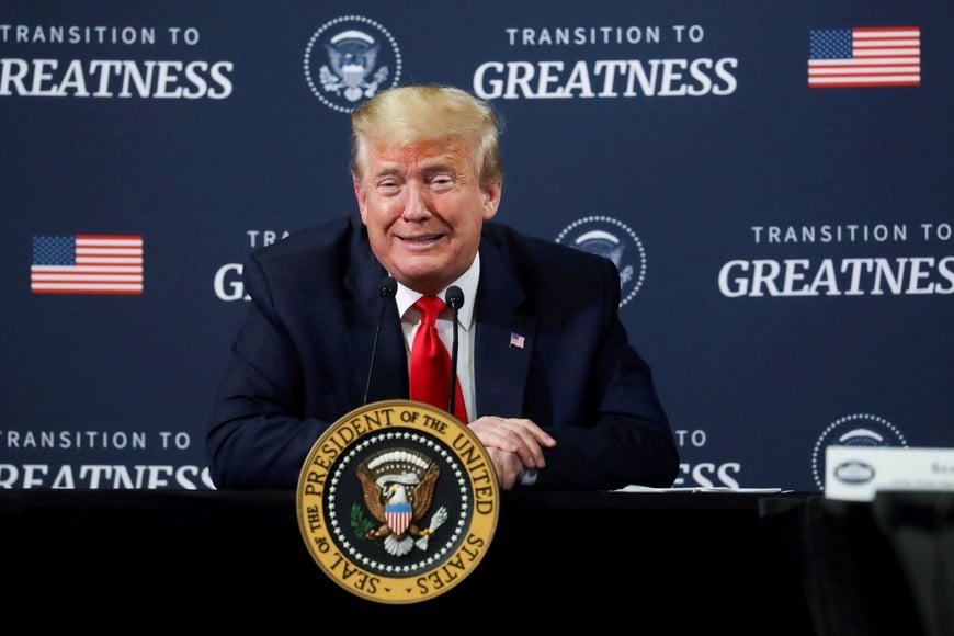 FILE PHOTO: U.S. President Donald Trump reacts as he holds a "listening session" meeting with members of the local African American business community during a visit to the Ford Rawsonville Components Plant in Ypsilanti, Michigan, U.S., May 21, 2020. REUTERS/Leah Millis/File Photo