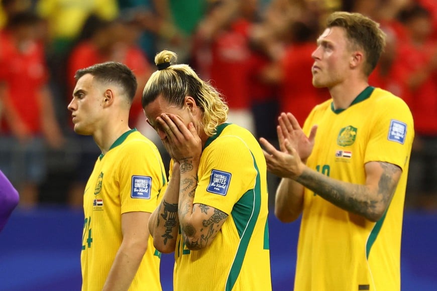 Soccer Football - FIFA World Cup 2026 - Round of 32 - Australia v Egypt - Dallas Stadium, Arlington, Texas, U.S. - July 3, 2026
Australia's Paul Okon Engstler, Jackson Irvine and Harry Souttar look dejected after the match as Australia are eliminated from the World Cup REUTERS/Kai Pfaffenbach