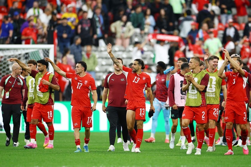Soccer Football - FIFA World Cup 2026 - Round of 32 - Switzerland v Algeria - BC Place, Vancouver, Canada - July 2, 2026
Switzerland's Ricardo Rodriguez and Ruben Vargas celebrate after the match with teammates REUTERS/Agustin Marcarian