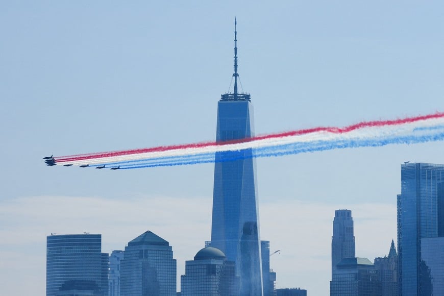 Military aircraft perform a flyover during the Sail 250 parade of ships in New York Harbor as the United States celebrates its 250th anniversary on Independence Day, as seen from Liberty State Park in Jersey City, New Jersey, U.S., July 4, 2026. REUTERS/Adam Gray