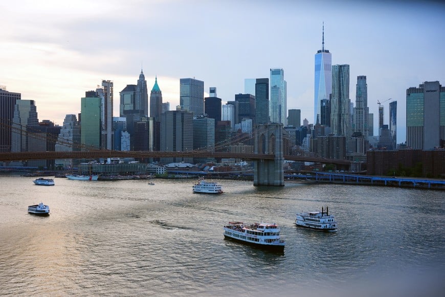Boats sail on the East River by the Brooklyn Bridge, as the United States celebrates its 250th anniversary on Independence Day, in New York City, U.S., July 4, 2026. REUTERS/Angelina Katsanis