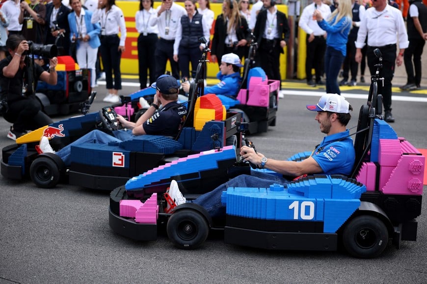 Formula One F1 - British Grand Prix - Silverstone Circuit, Silverstone, Britain - July 5, 2026
Alpine's Pierre Gasly, Red Bull's Max Verstappen and Alpine's Franco Colapinto in cars made of Lego blocks ahead of the race REUTERS/Andrew Boyers