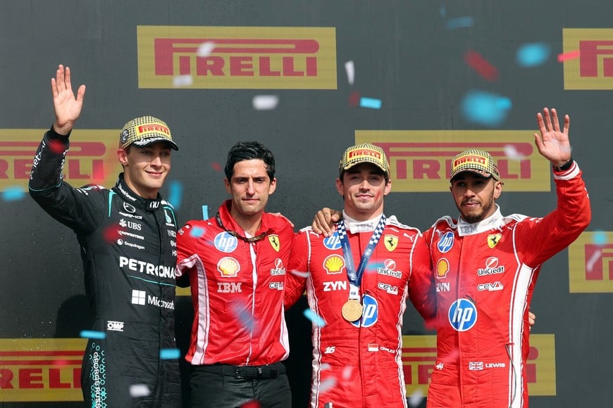Formula One F1 - British Grand Prix - Silverstone Circuit, Silverstone, Britain - July 5, 2026
Ferrari's Charles Leclerc celebrates on the podium after winning the British Grand Prix with Mercedes' George Russell who finished second and Ferrari's Lewis Hamilton who finished third REUTERS/Andrew Boyers