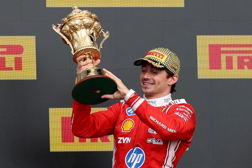 Formula One F1 - British Grand Prix - Silverstone Circuit, Silverstone, Britain - July 5, 2026
Ferrari's Charles Leclerc celebrates with a trophy on the podium after winning the British Grand Prix REUTERS/Andrew Boyers