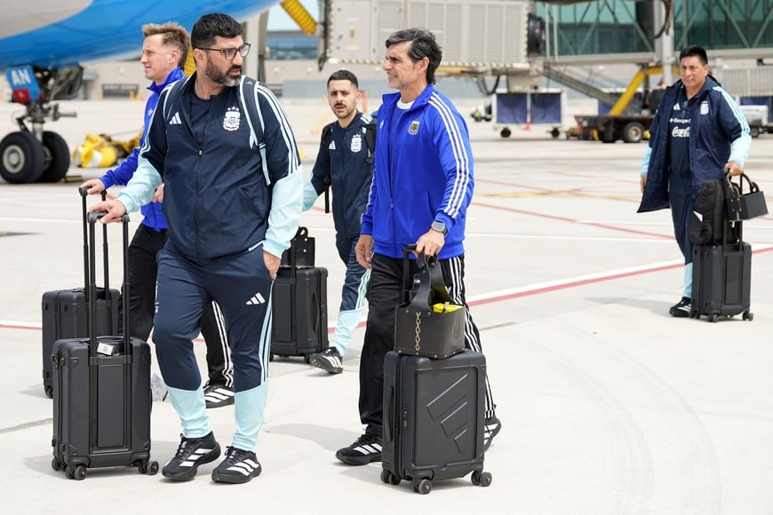 May 31, 2026; Kansas City, Missouri, USA; Argentina assistant manager Roberto Ayala (center) and other team staff arrive for the 2026 FIFA World Cup at Kansas City International Airport. Mandatory Credit: Denny Medley-Imagn Images