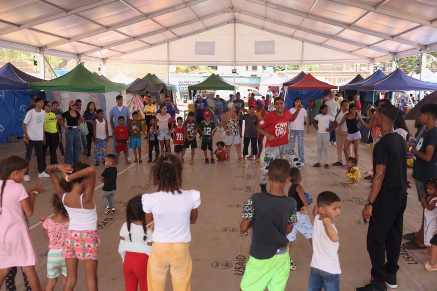 Children take part in an activity at a makeshift shelter for displaced people run by the United Nations at a baseball field, in the aftermath of the June 24 earthquakes, in Catia La Mar, La Guaira state, Venezuela, July 9, 2026. REUTERS/Leonardo Fernandez Viloria