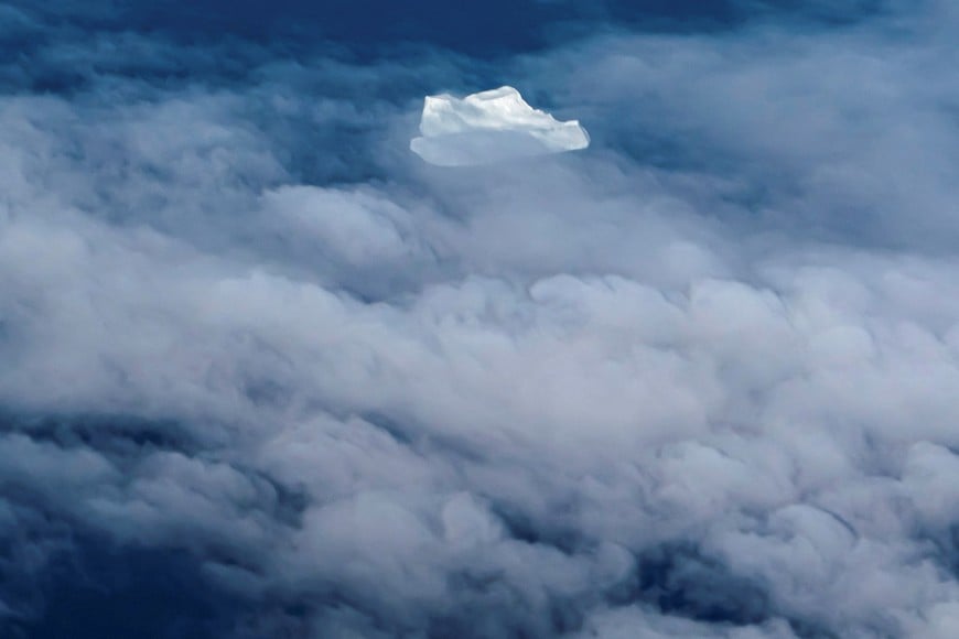 An iceberg and clouds are seen at the west coast close to Tasiilaq, Greenland, September 17, 2021. REUTERS/Hannibal Hanschke TPX IMAGES OF THE DAY