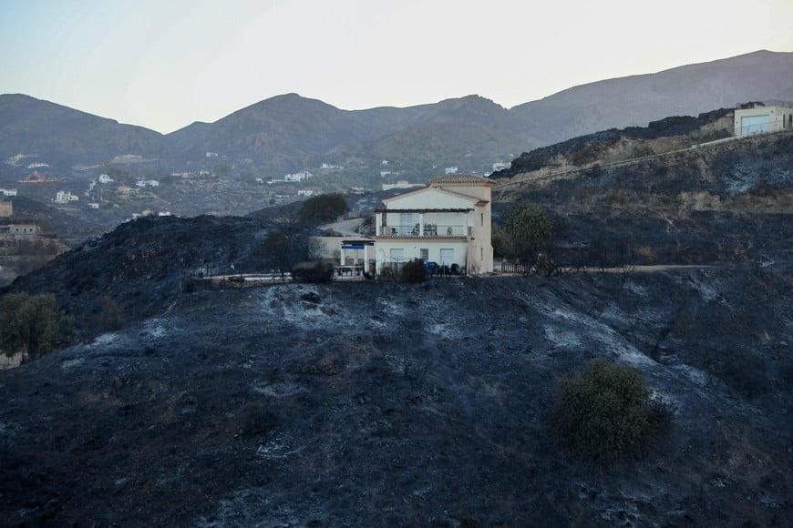 A damaged home remains amidst a burned area following deadly wildfires affecting Almeria province, in Bedar, Almeria, Spain, July 10, 2026. REUTERS/Loyola Perez de Villegas Muniz