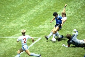 FILE PHOTO: Football - 1986 FIFA World Cup - Quarter Final - England v Argentina - Azteca Stadium, Mexico City - 22/6/86 Diego Maradona scores for Argentina. Mandatory Credit: Action Images / Juha Tamminen/File Photo