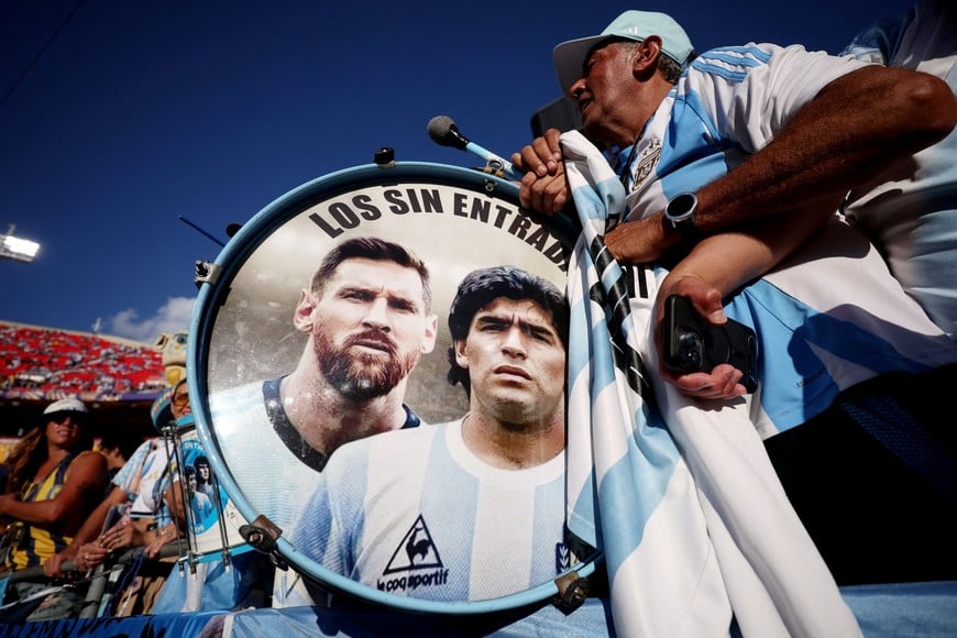 FILE PHOTO: Soccer Football - FIFA World Cup 2026 - Quarter Final - Argentina v Switzerland - Kansas City Stadium, Kansas City, Missouri, U.S. - July 11, 2026
Argentina fans play drums displaying Lionel Messi and Diego Maradona inside the stadium before the match REUTERS/Lee Smith/File Photo