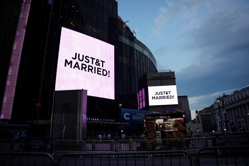 A screen displays a message referencing singer Taylor Swift and National Football League (NFL) player Travis Kelce outside Madison Square Garden, the venue for their reported wedding celebrations, in New York, U.S., July 3, 2026. REUTERS/Angelina Katsanis