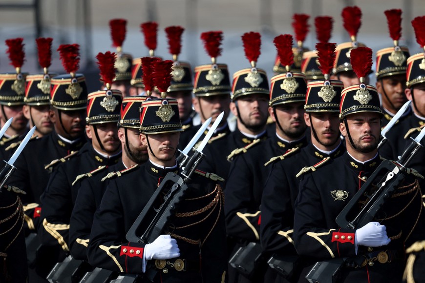 French Republican Guards stand in position before the start of the annual Bastille Day military parade on the Place de la Concorde in Paris, France, July 14, 2026. REUTERS/Tom Nicholson