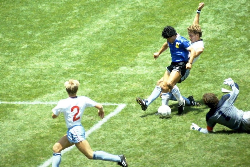FILE PHOTO: Football - 1986 FIFA World Cup - Quarter Final - England v Argentina - Azteca Stadium, Mexico City - 22/6/86 Diego Maradona scores for Argentina. Action Images via Reuters/Juha Tamminen/File Photo