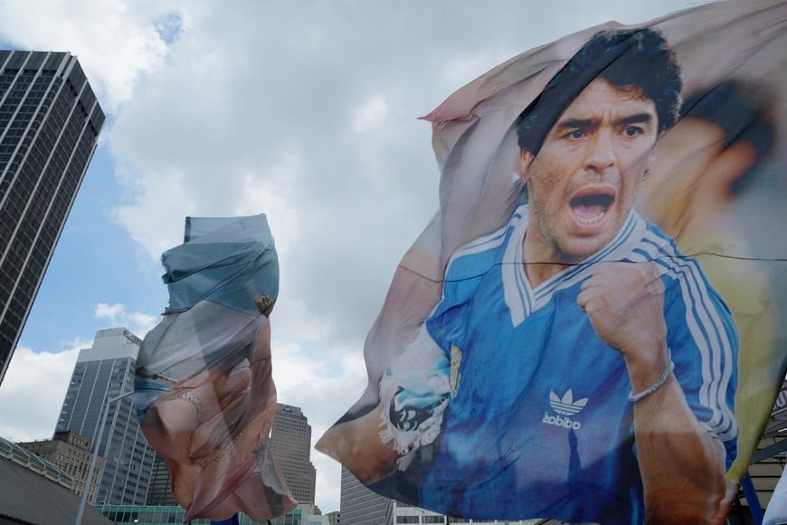 Soccer Football - FIFA World Cup 2026 - Semi Final - England v Argentina - Fans gather in Atlanta - Atlanta, Georgia, U.S. - July 15, 2026
A flag of former Argentina player Diego Maradona is displayed before the match REUTERS/Megan Varner