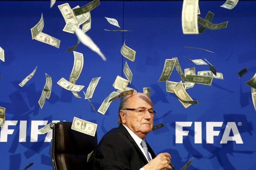 REUTERS PICTURES 40th ANNIVERSARY COLLECTION: British comedian known as Lee Nelson (unseen) throws banknotes at FIFA President Sepp Blatter as he arrives for a news conference after the Extraordinary FIFA Executive Committee Meeting at the FIFA headquarters in Zurich, Switzerland July 20, 2015. REUTERS/Arnd Wiegmann SEARCH "REUTERS PICTURES 40th ANNIVERSARY COLLECTION" FOR THIS PACKAGE