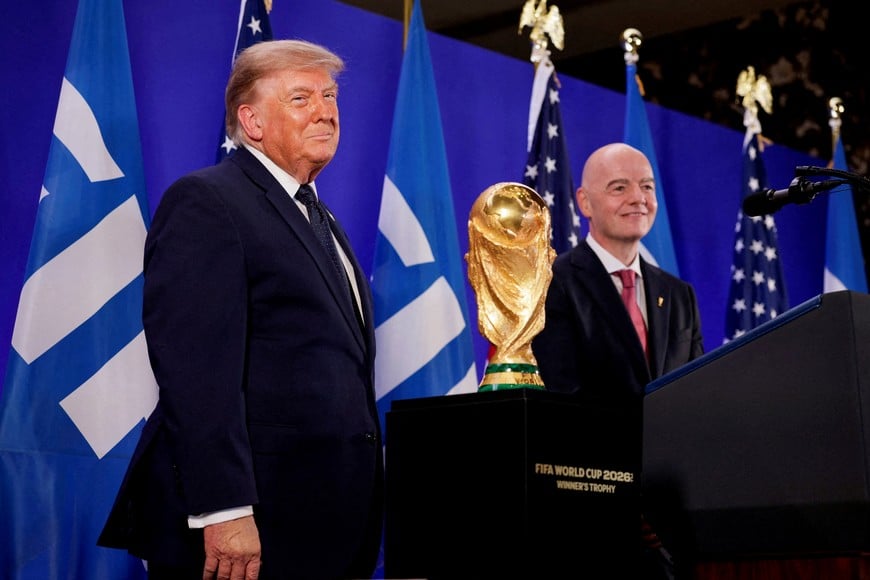 U.S. President Donald Trump and FIFA President Gianni Infantino stand next to the FIFA World Cup Trophy, as they attend a FIFA reception at Trump Tower in New York City, U.S., July 17, 2026. REUTERS/Evan Vucci TPX IMAGES OF THE DAY