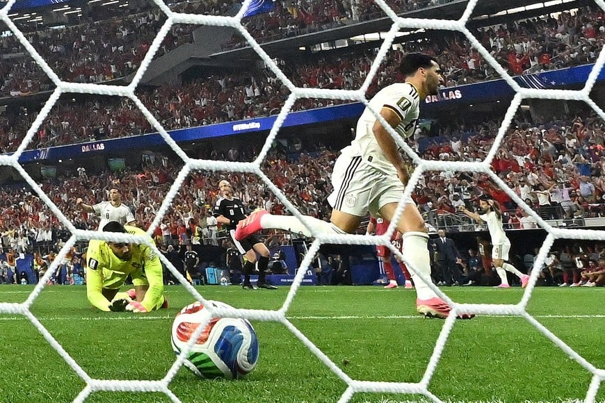 Soccer Football - FIFA World Cup 2026 - Round of 16 - Portugal v Spain - Dallas Stadium, Arlington, Texas, U.S. - July 6, 2026
Spain's Mikel Merino celebrates scoring their first goal as Portugal's Diogo Costa reacts IMAGN IMAGES via Reuters/Maria Lysaker