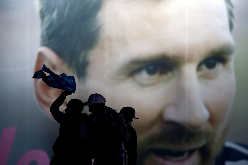 Soccer Football - FIFA World Cup 2026 - Final - Spain v Argentina - Fans gather in Buenos Aires - Buenos Aires, Argentina - July 19, 2026
Argentina fans are silhouetted against a large image of Lionel Messi in Buenos Aires after Argentina lost the FIFA World Cup final against Spain REUTERS/Matias Baglietto TPX IMAGES OF THE DAY
