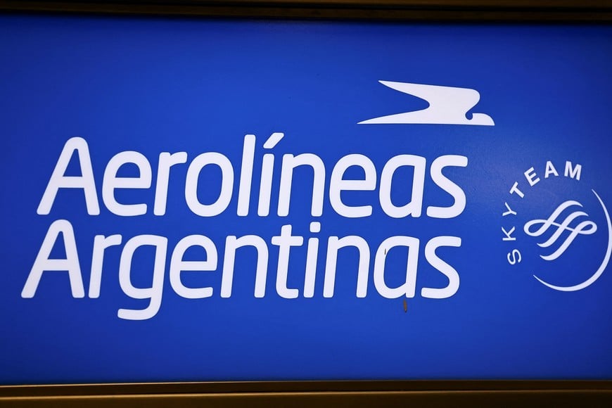 The Aerolineas Argentinas airline logo is seen in a screen at the Aeroparque Jorge Newbery airport, in Buenos Aires, Argentina December 26, 2024. REUTERS/Agustin Marcarian